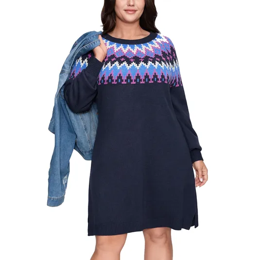 Navy sweater dress with colorful geometric patterns on the chest and sleeves, paired with a blue denim jacket draped over the shoulder.