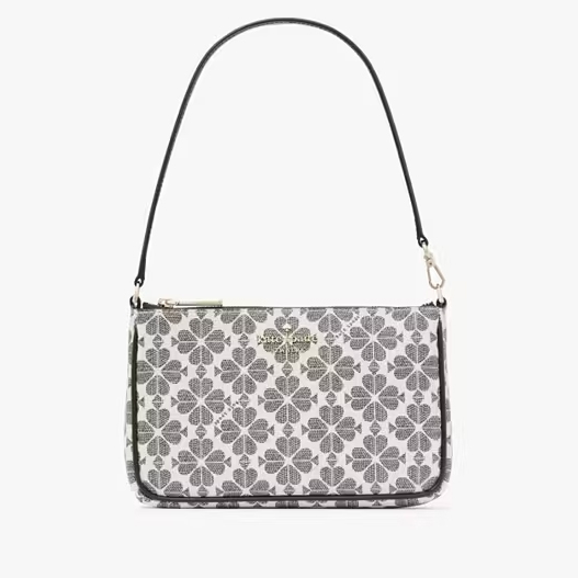 A shoulder bag with a floral pattern and a brand logo on the front.