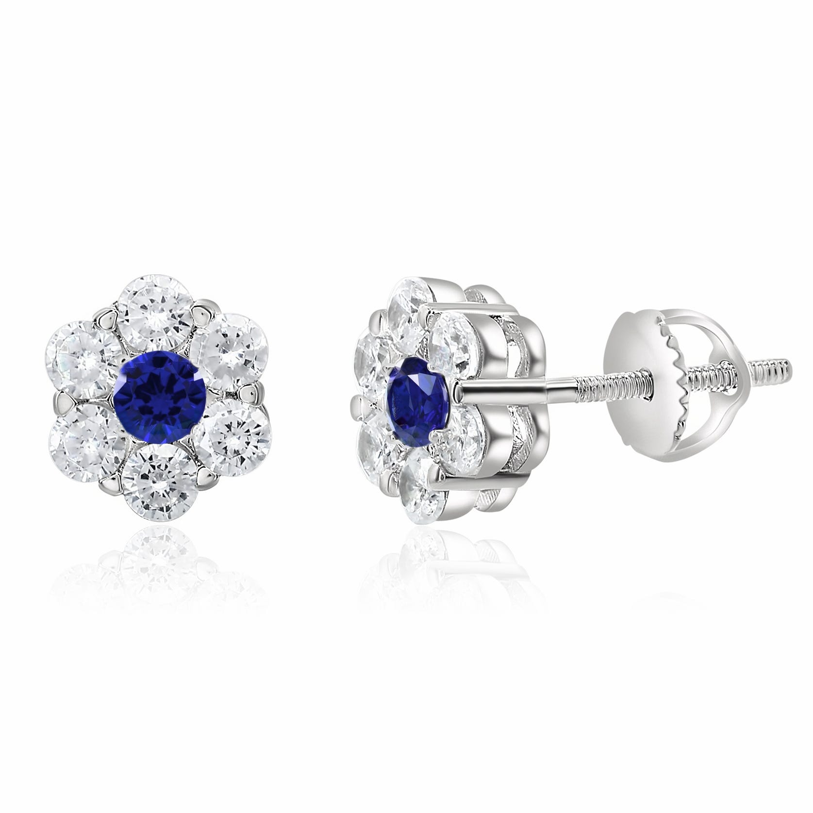 Stud earrings with a central blue gemstone surrounded by clear, round-cut stones in a floral arrangement, set in a silver-tone metal.