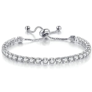 A silver adjustable bracelet with a chain and a row of round, sparkling stones, likely designed with a sliding clasp for easy sizing.