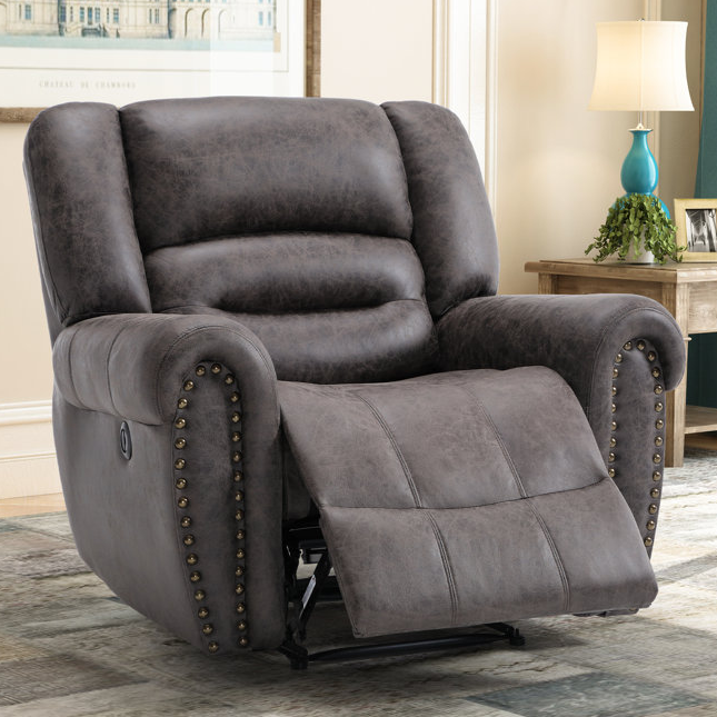 A gray, upholstered power recliner with a USB port, featuring a plush backrest and seat with studded armrests. It has a footrest that extends forward for added comfort.
