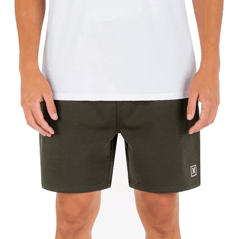 Dark green Hurley sweat shorts with a white logo near the hem, featuring a simple and comfortable design, paired with a white shirt.