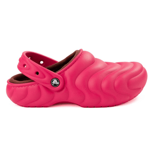 Bright pink textured clog with a strap, featuring a wave pattern and a lined interior for added comfort.