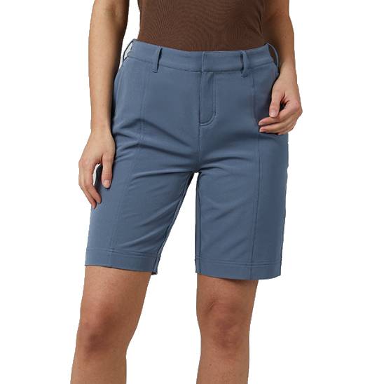 A person is wearing knee-length, blue tailored shorts with belt loops and a front zip closure, paired with a brown top.
