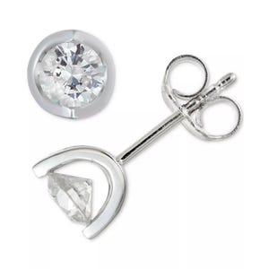 A pair of round stud earrings with a bezel setting featuring a clear gemstone, shown from the front and side, with a post and butterfly clutch back.