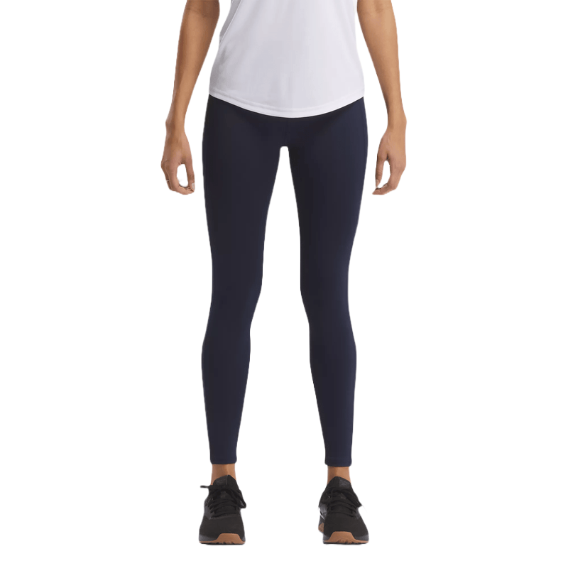 ID Train Big Logo Leggings are navy blue athletic leggings featuring a high-rise fit, designed for comfort and support during workouts. They are paired with a white top and black sneakers.