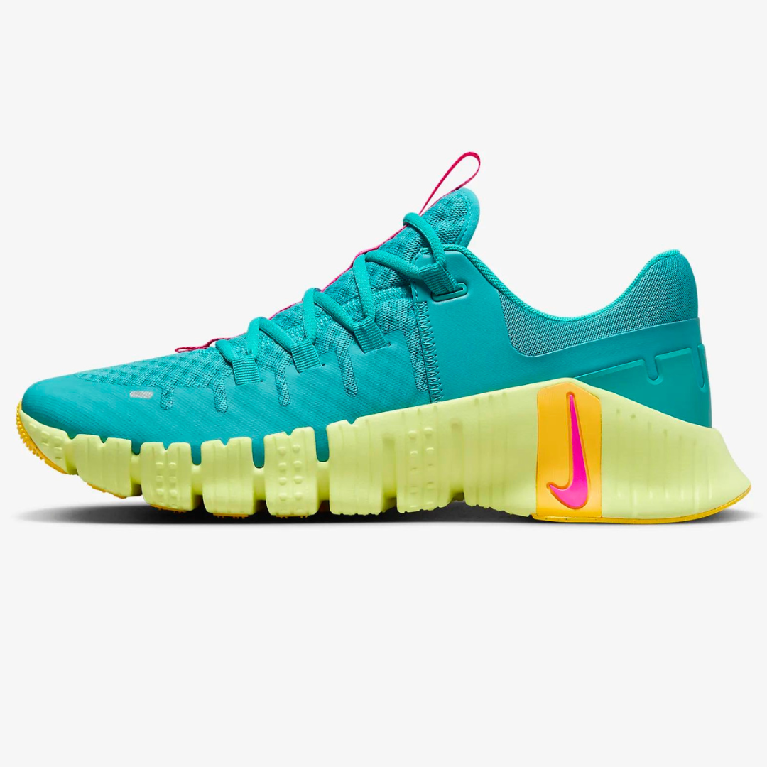 A turquoise and yellow sneaker with a unique sole and pink accent on the logo.