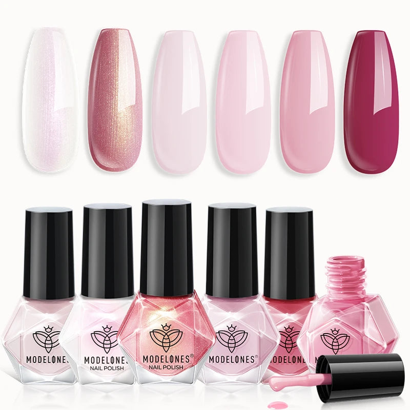 A collection of Modelones nail polishes includes six shades ranging from pearlescent white to deep pink. The bottles have a geometric shape with a black cap.