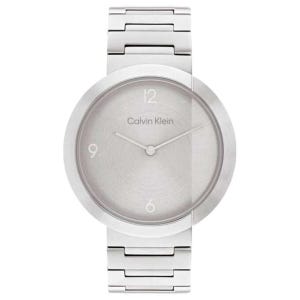 The Calvin Klein Eccentric Watch features a minimalist design with a silver round face, sleek dial, and a stainless steel link bracelet. The watch face displays only the numbers 12, 9, and 6.