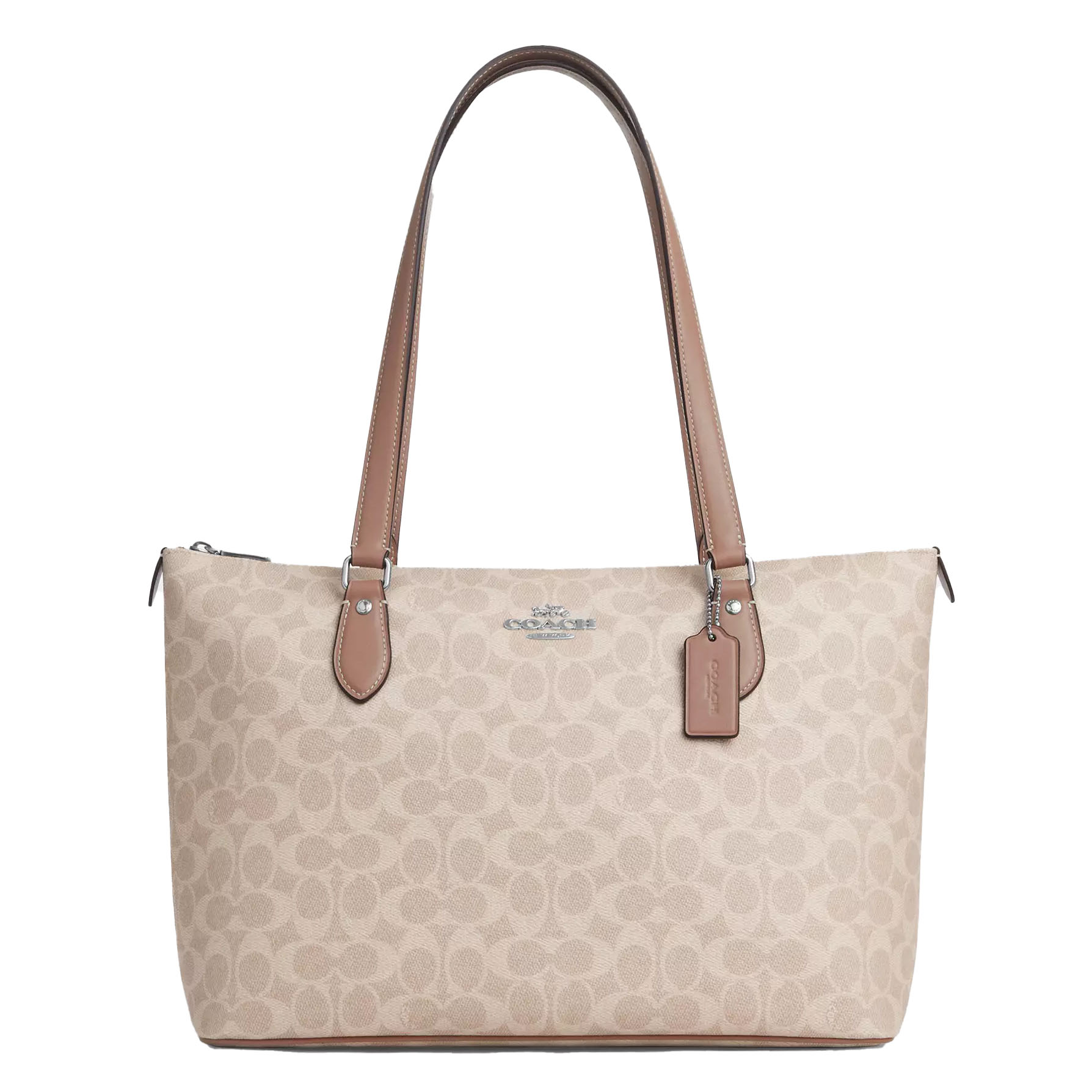 Beige Coach tote bag with signature \“C\“ pattern, featuring dual leather handles and a leather hangtag.