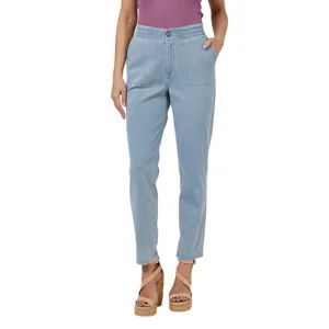 Light blue high-waisted jeans with an elastic waistband and front button, paired with a sleeveless purple top and tan wedge sandals.
