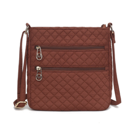A brown quilted shoulder bag with a crossbody strap and two front zippered pockets, featuring metallic hardware.
