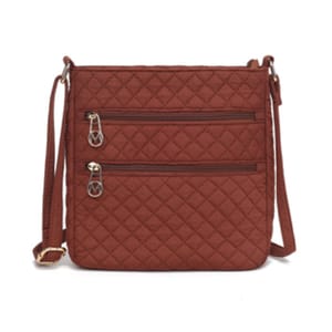 A brown quilted shoulder bag with a crossbody strap and two front zippered pockets, featuring metallic hardware.