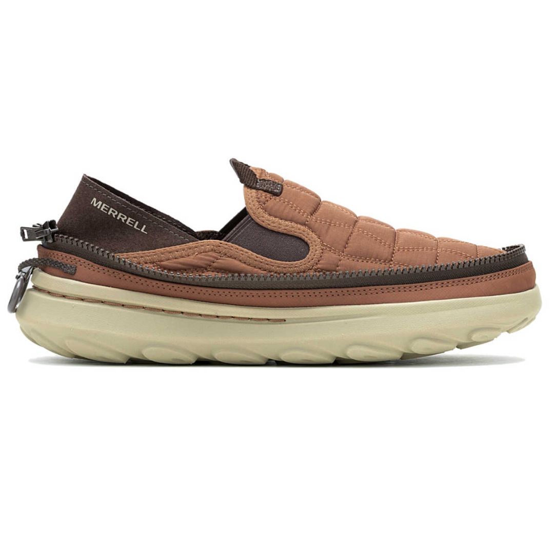 A Merrell slip-on shoe in brown with a quilted design, featuring a prominent zipper around the sole and a thick, beige textured sole.