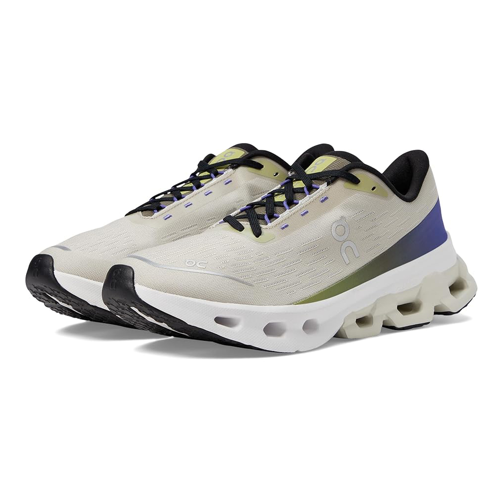 White and blue running shoes with distinctive cushion sole design and black laces, featuring the \“OC\“ logo.