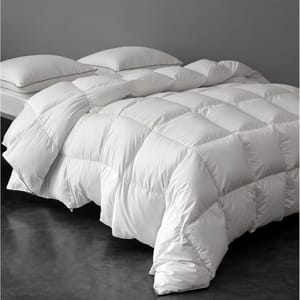 Queen Downfort Comforter: A plush, white, quilted comforter with a grid pattern featuring a thick, fluffy appearance.