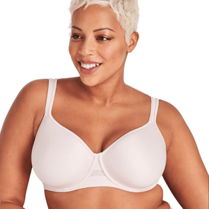 A woman wears a light-colored bra with underwire support and adjustable straps, designed for comfort and a smooth silhouette.