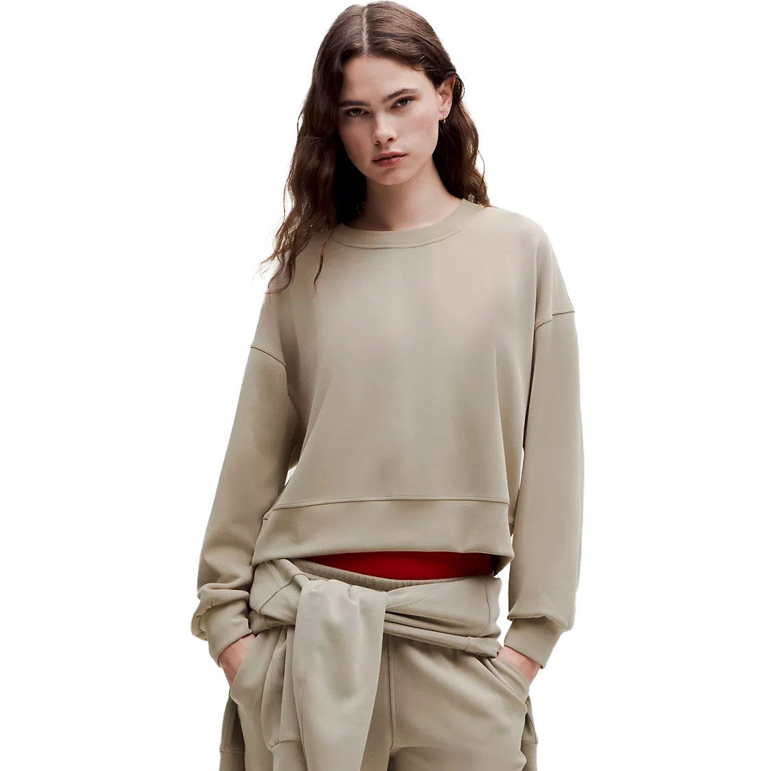 The lululemon Oversized Softstreme Crew is a relaxed-fit, long-sleeve sweatshirt in a neutral tone, featuring a soft, comfortable fabric with ribbed cuffs and hem. It's designed for a casual, cozy look and feel.
