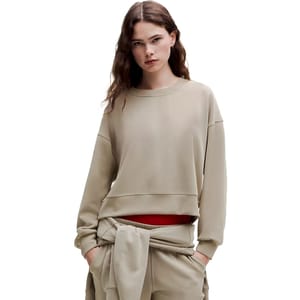 The lululemon Oversized Softstreme Crew is a relaxed-fit, long-sleeve sweatshirt in a neutral tone, featuring a soft, comfortable fabric with ribbed cuffs and hem. It's designed for a casual, cozy look and feel.