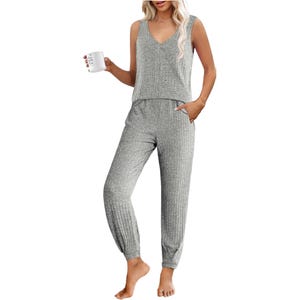 A sleeveless, V-neck, gray ribbed knit tank top paired with matching high-waisted jogger-style pants, providing a cozy and comfortable sleepwear set.