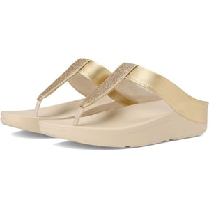 Gold wedge flip-flop sandals with a glittery strap design and cushioned sole for comfort.