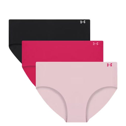 Set of three Under Armour women's seamless hipster underwear in black, pink, and light pink, each featuring the brand's logo on the waistband.