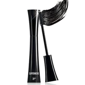 A black mascara from IT Cosmetics with the name \“Superhero,\“ featuring a curved brush applicator.