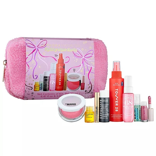 A collection of various cosmetic items including lip balms, a lip mask, facial sprays, moisturizer, and peel pads, displayed with a fluffy pink cosmetics bag.