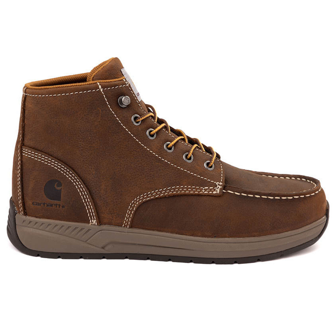 Carhartt Men's Chukka Boots are brown with durable leather, detailed with contrast stitching and a moc toe design. They feature a lace-up closure with metal eyelets and a cushioned sole for comfort.