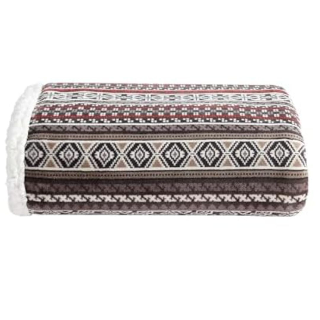 Eddie Bauer Sherpa Throw features a geometric pattern in shades of red, brown, and beige, with a plush, white sherpa lining for added warmth and comfort.