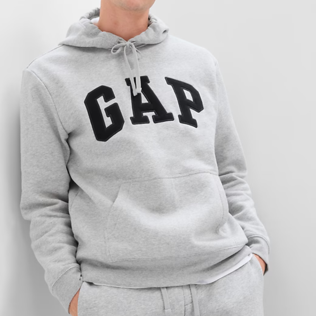 Gray pullover hoodie with a kangaroo pocket, adjustable drawstrings, and the GAP logo in large black letters on the chest.