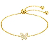 A gold chain bracelet featuring a butterfly charm adorned with small crystals, with an adjustable slider closure and two small gold beads at the ends of the chain.