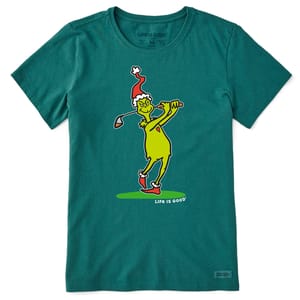 The teal tee features a cartoon of the Grinch playing golf, wearing a Santa hat and outlined in yellow, with \“Life is Good\“ printed below.