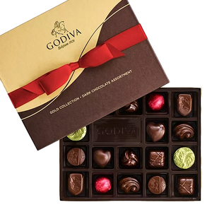 An assortment of 18 dark chocolates in a variety of shapes, some with colorful wrappings, presented in a box with a red ribbon design on the lid.
