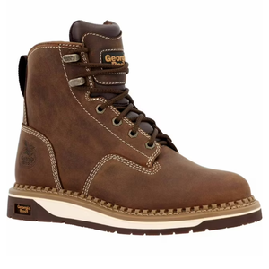 Brown leather work boot with white stitching, padded collar, and metal eyelets for laces. Features a label with \“Georgia Boot,\“ a logo on the side, and a rugged sole for durability.