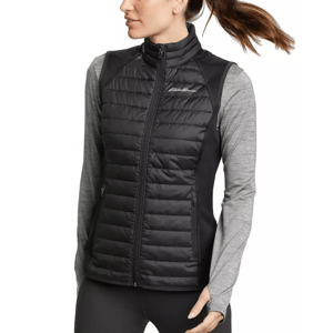 Eddie Bauer Emberlite Hybrid Vest is a black, lightweight women's vest featuring quilted front panels for insulation and stretchy side panels for flexibility, with a full-zip front and brand logo on the chest.