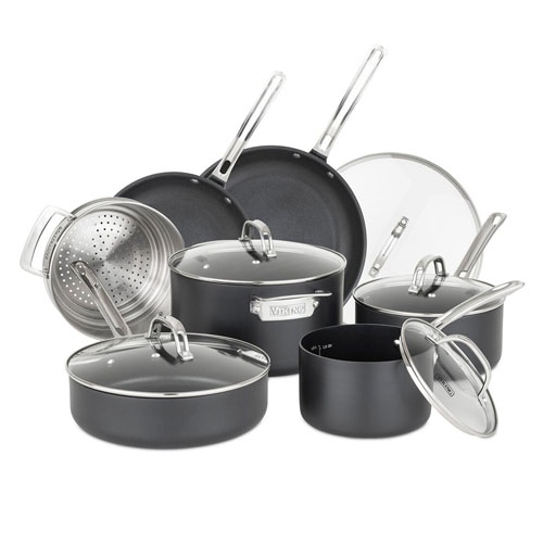 A set of nonstick cookware includes various pots, pans, glass lids, and a steamer insert with stainless handles.