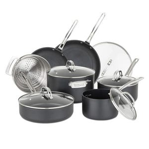 A set of nonstick cookware includes various pots, pans, glass lids, and a steamer insert with stainless handles.