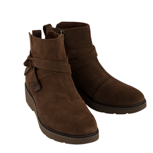 Brown suede ankle boots with side zippers and wrap-around straps, featuring a low platform sole.