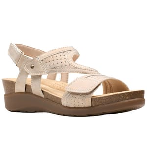 A beige women's sandal with adjustable straps, featuring a cushioned footbed and cork wedge, designed for comfort and casual wear.