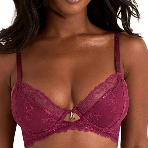 A maroon lace bra with delicate floral patterns and a small central pendant detail.
