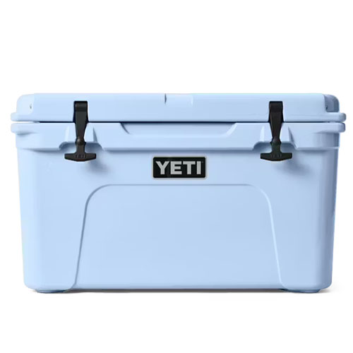 A light blue YETI cooler with black latches and the YETI logo on the front.