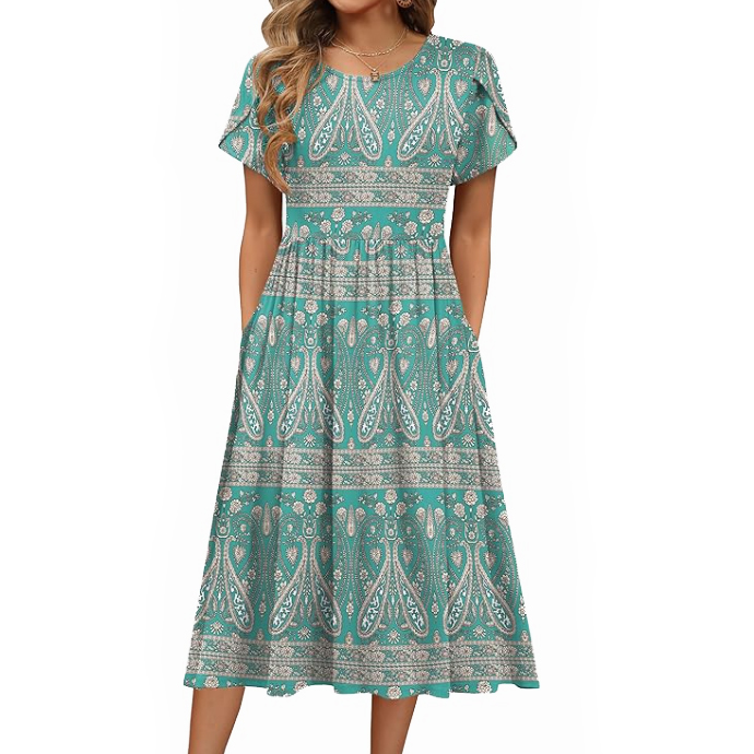 Teal knee-length dress with short sleeves featuring an intricate paisley and floral pattern. The dress has a round neckline and a slightly gathered waist for a flattering fit.