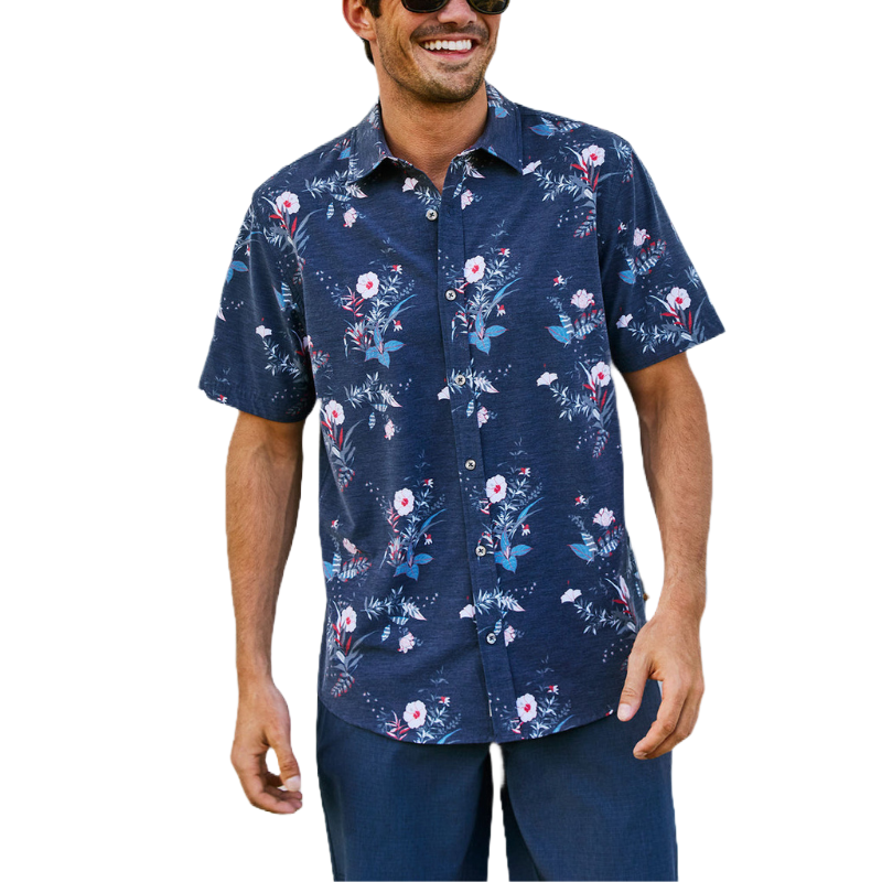 A navy blue short-sleeve button-up shirt with a floral pattern in pink and white, suitable for casual wear. The shirt appears lightweight and relaxing, ideal for warm weather.