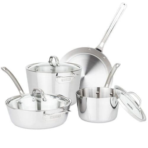 A set of stainless steel cookware including a saucepan, a sauté pan, a stockpot, and a frying pan, with matching lids.