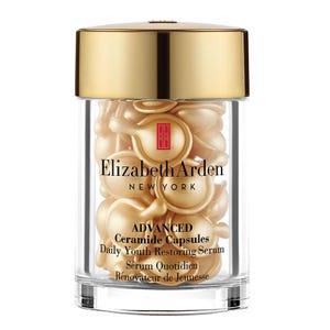 Elizabeth Arden Advanced Ceramide Capsules in a clear container with a gold cap, labeled as a daily youth restoring serum.