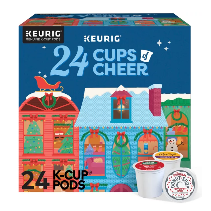 A festive-themed Keurig K-Cup Advent Calendar box containing 24 individual K-Cup pods, with one visible pod showing the McCafé logo.