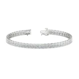 A silver tennis bracelet with square-cut diamonds set in a continuous line, featuring a clasp closure.
