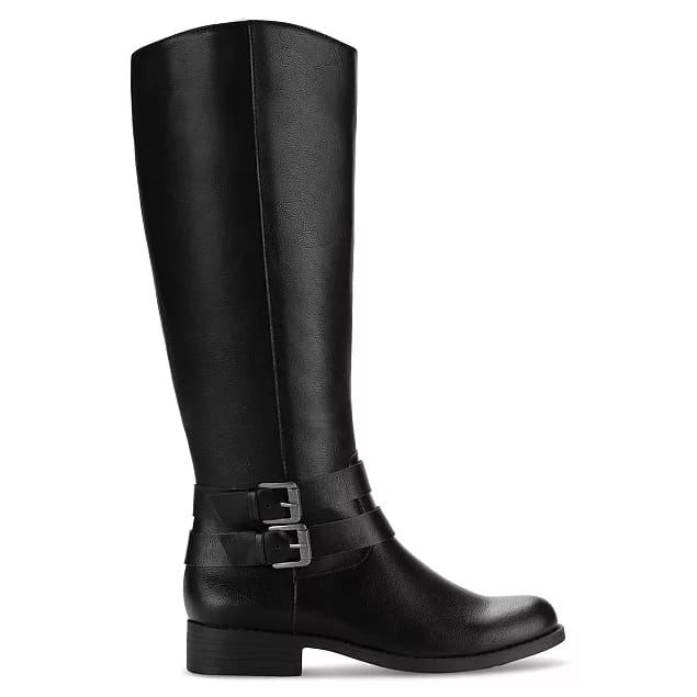 Black knee-high riding boots featuring a low heel and two buckle straps around the ankle. The boots are designed with a wider calf for a comfortable fit.