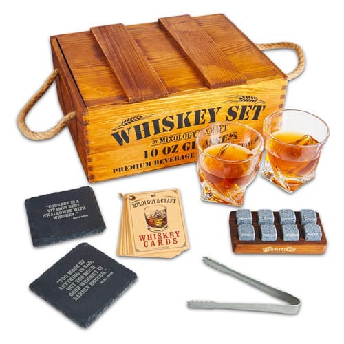 A whiskey set containing a storage crate, two 10-ounce glasses, eight whiskey stones, coasters, and recipe cards.